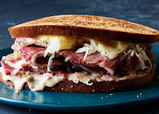 Reuben sandwich with pastrami, swiss and slaw on grilled rye